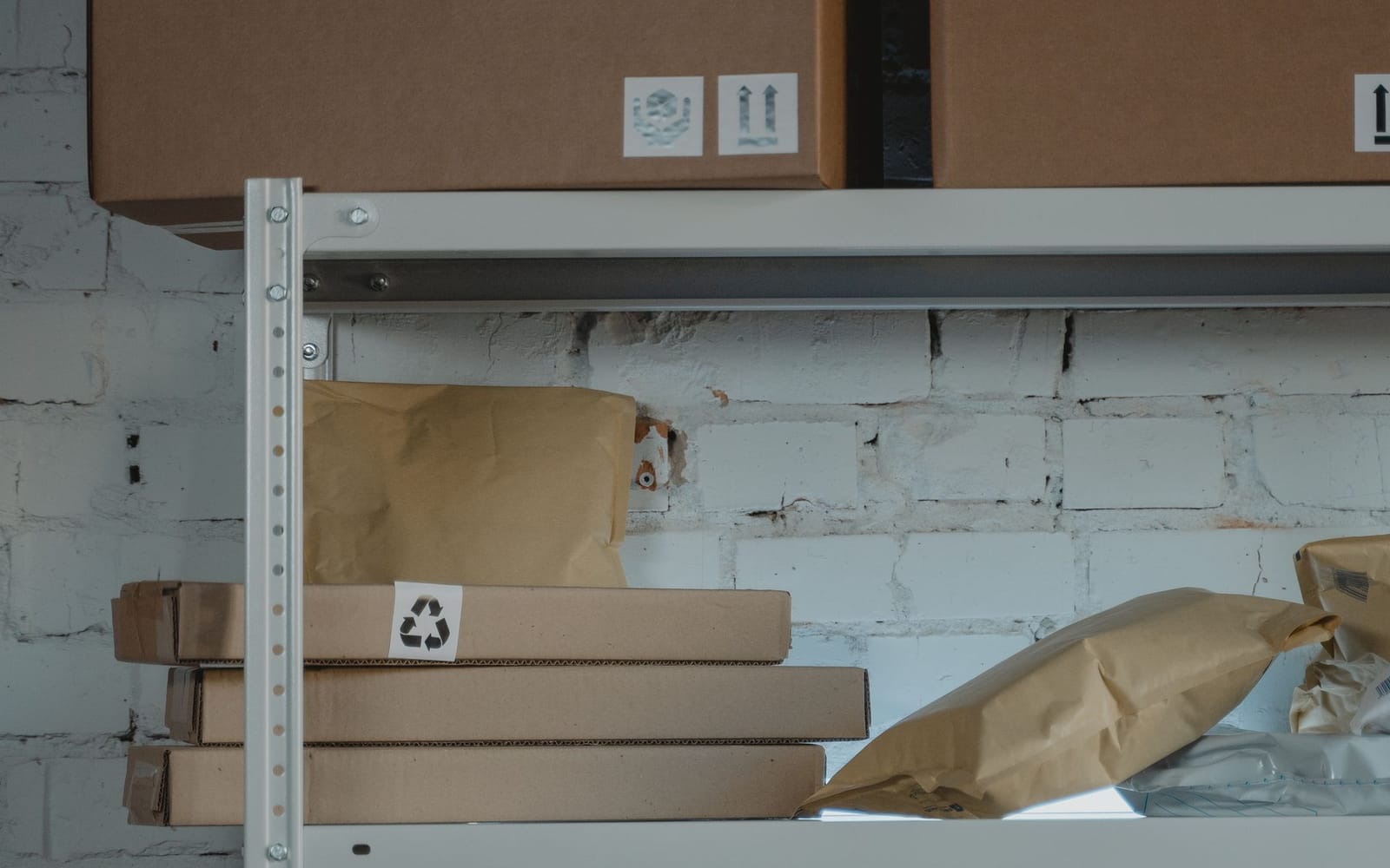 Wrapped parcels on a shelf, ready for dispatch