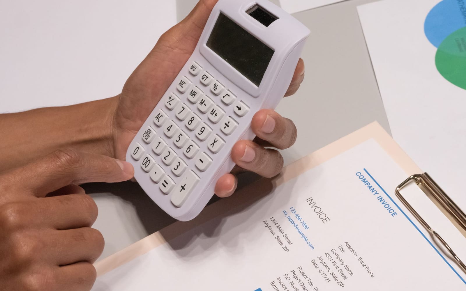 Calculator and invoice on a desk